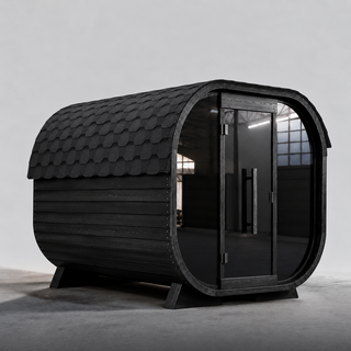 Fjorr Cube Sauna med 9kW hariva ovn, sortmalet thermowood.